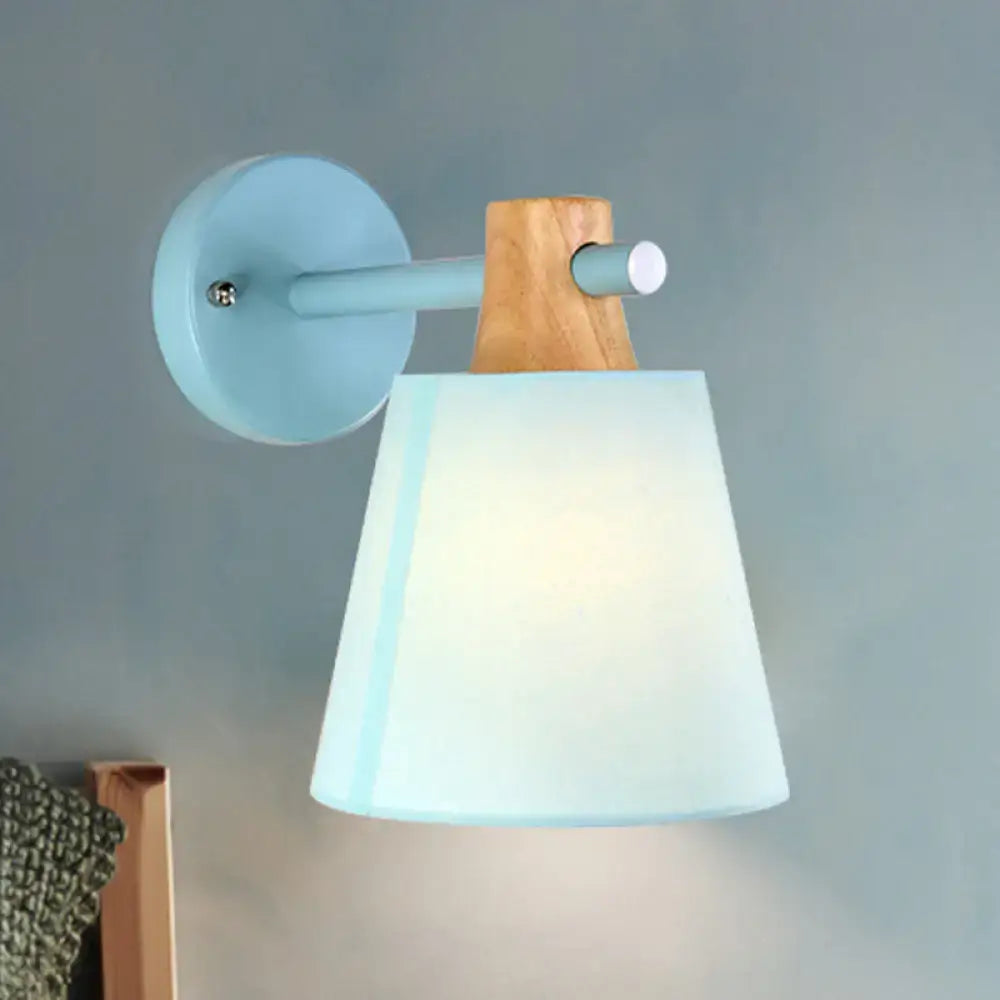 Yellow macaron fabric wall light with wood accent sconce by Decorbites mounted on blue wall plate on Tampa Home & Garden Store