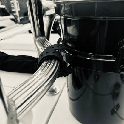 Hoss Straps Basic Bucket Strap Pack in black, strap wrapped around a chrome rail on Tampa Home & Garden Store