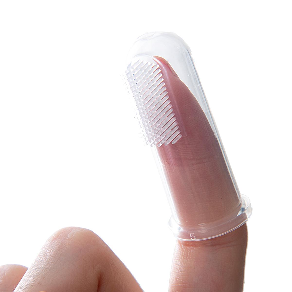Baby grooming brush with pink handle and white bristles inside a clear protective cap on Tampa Home & Garden Store