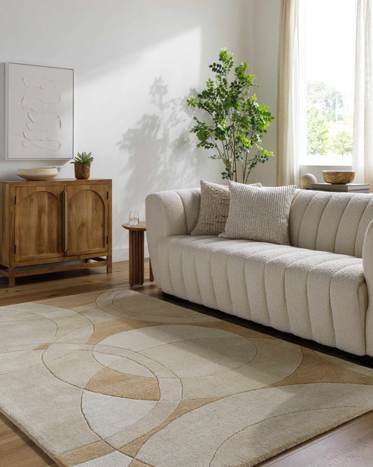 Yaxha Modern Wool Rug, beige tones with subtle circular pattern, living room setting on Tampa Home & Garden Store