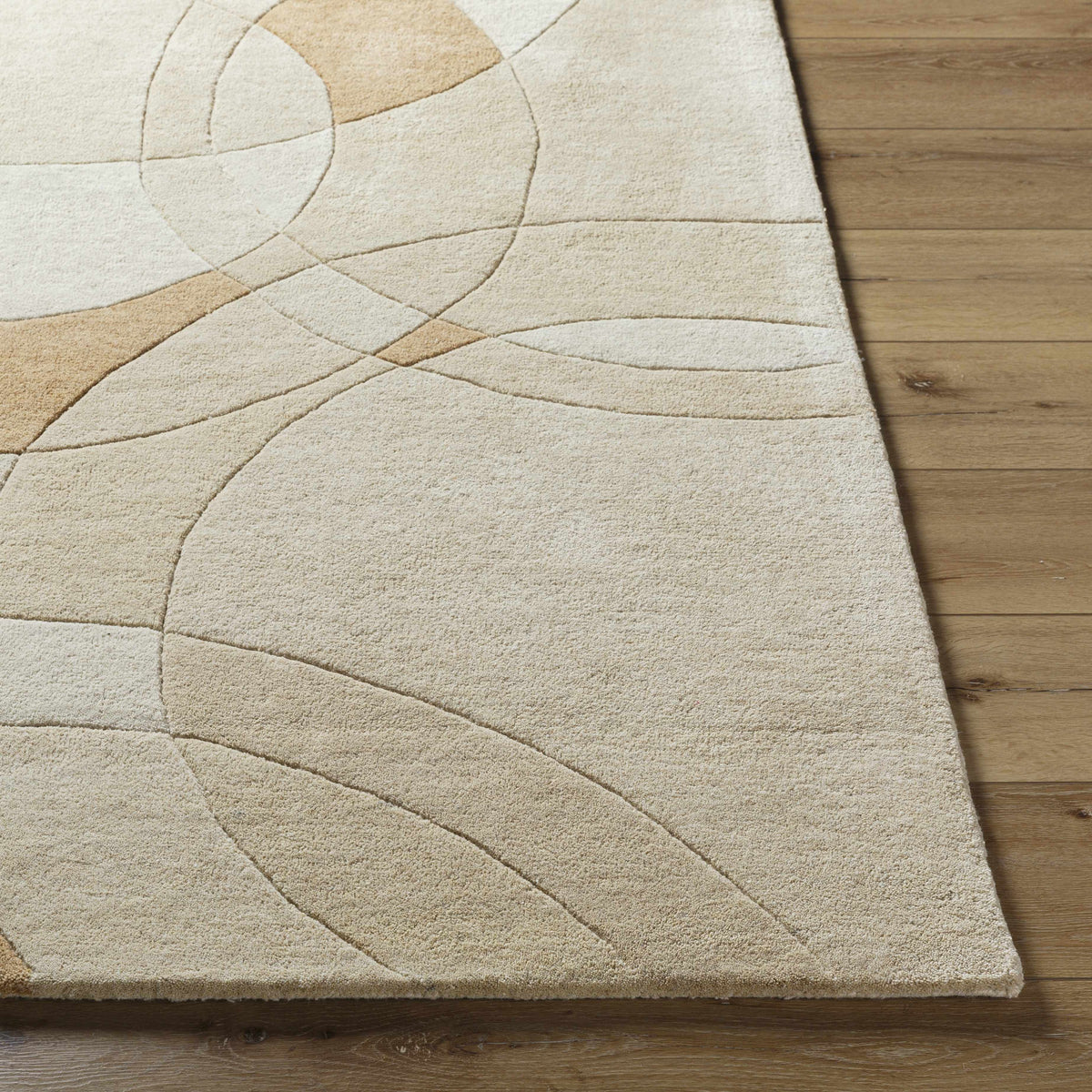 Yaxha Modern Wool Rug beige cream abstract circular pattern on wood floor by Boutique Rugs on Tampa Home & Garden Store