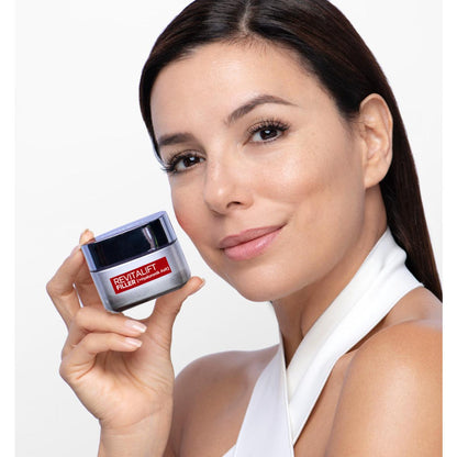 Face cream jar Revitalift Filler Hyaluronic Acid with red label held by model on Tampa Home & Garden Store