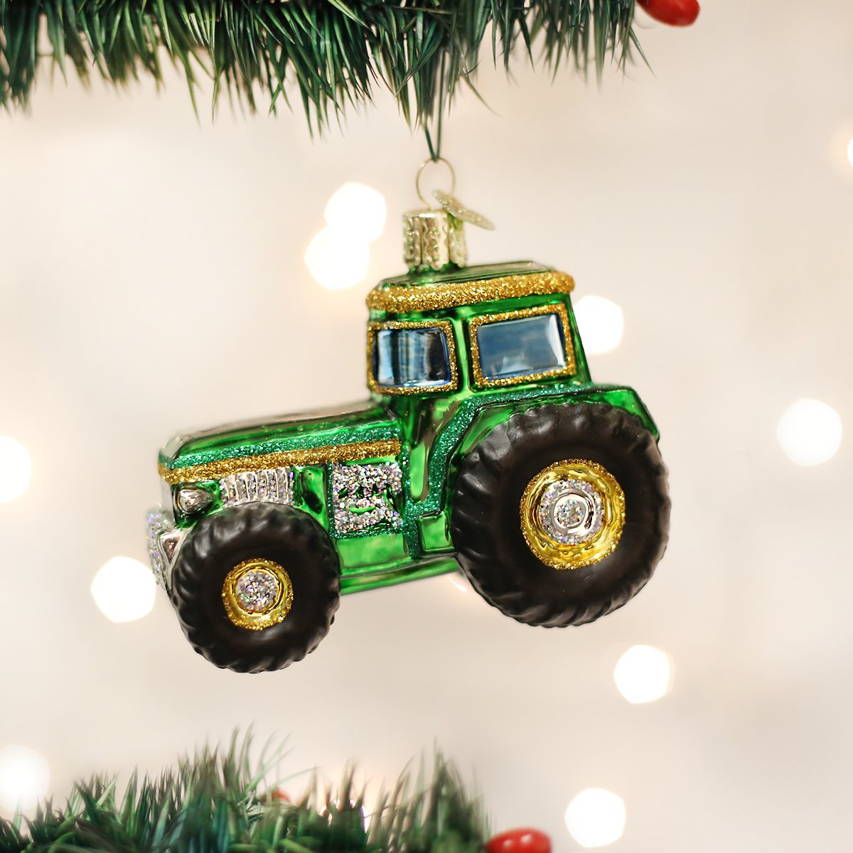 Adorno de cristal con forma de tractor verde