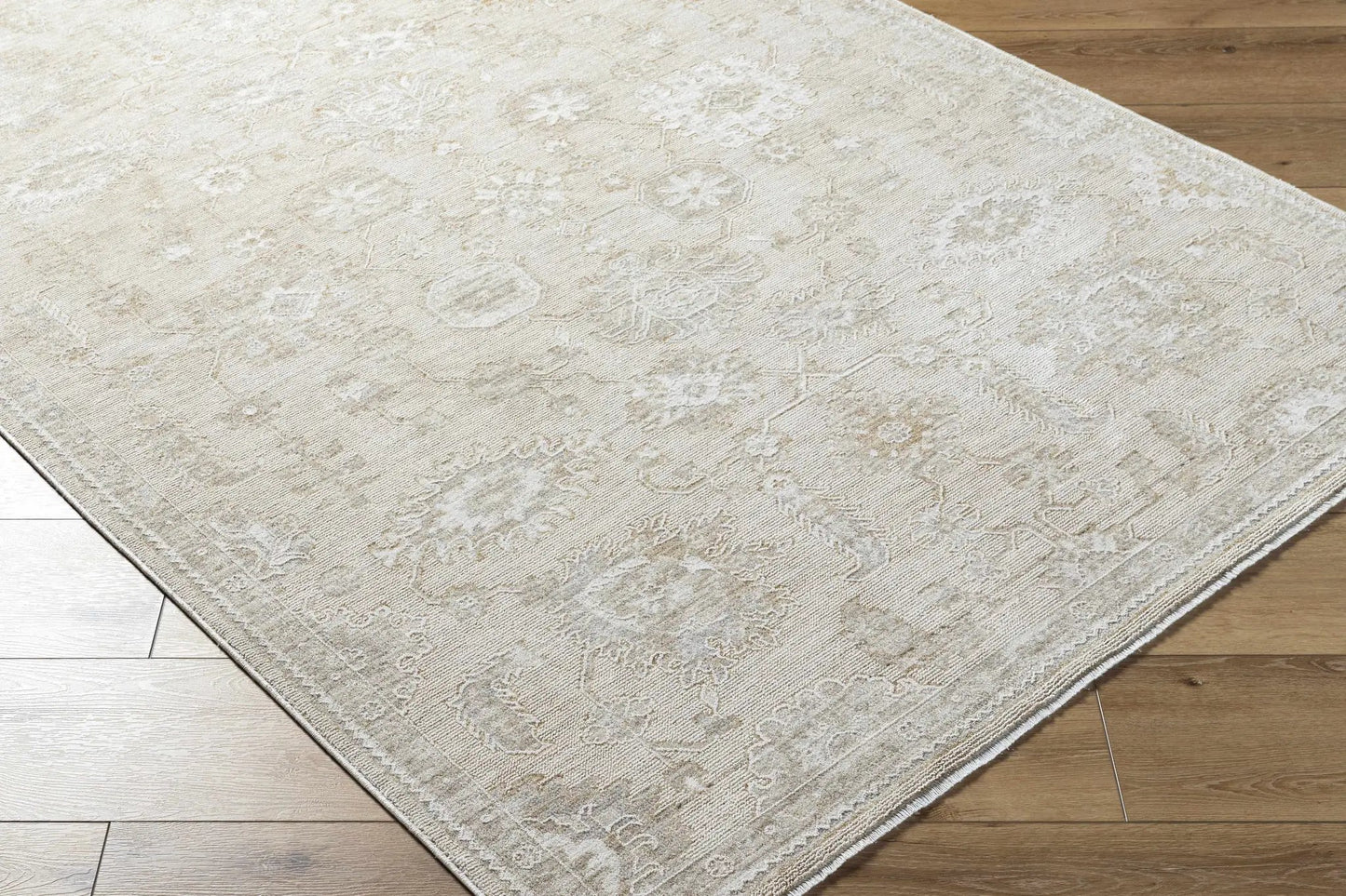 Yonca Luxe Rug Boutique Rugs cream-beige damask patterned rug on wood floor on Tampa Home & Garden Store