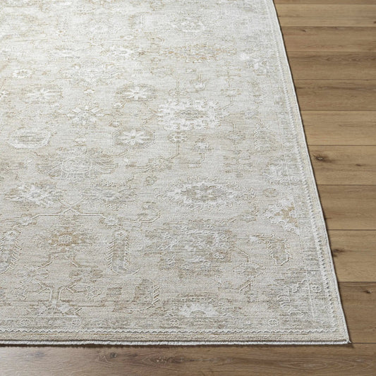 Yonca Luxe Rug cream beige distressed pattern area rug on wooden floor on Tampa Home & Garden Store