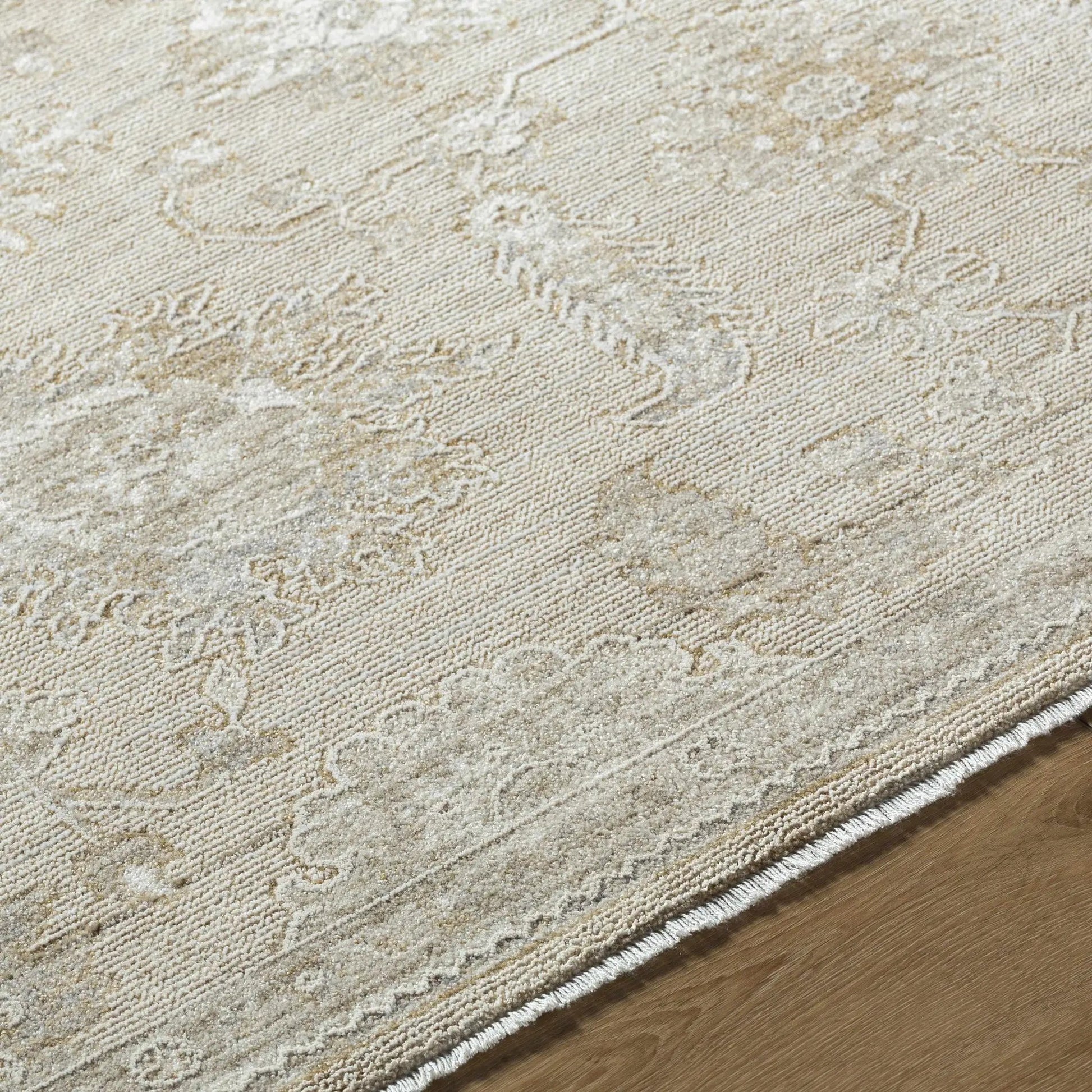 Yonca Luxe Rug by Boutique Rugs in beige cream with a subtle distressed pattern on Tampa Home & Garden Store
