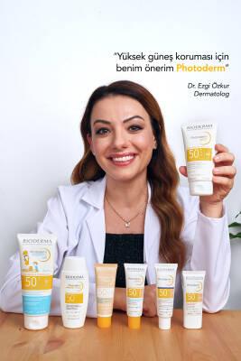 Bioderma Photoderm Spot SPF 50+ sunscreen tubes on table with a smiling woman in a lab coat on Tampa Home & Garden Store