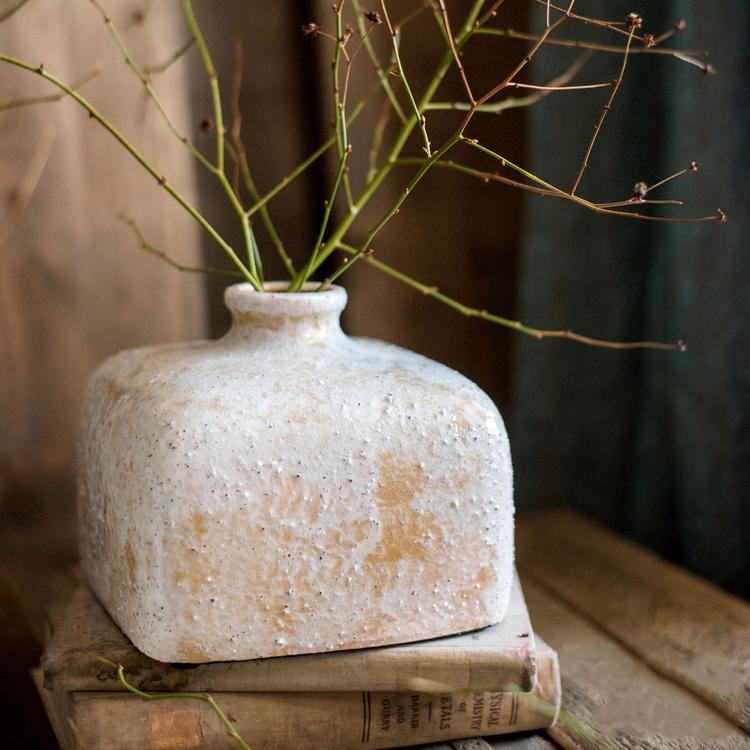 Zen Style Ceramic Vase by RusticReach, textured white with beige patches, twig stems on vintage books on Tampa Home & Garden Store