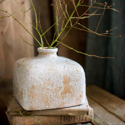 Zen Style Ceramic Vase by RusticReach, textured white with beige patches, twig stems on vintage books on Tampa Home & Garden Store