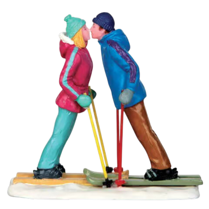 First Ski Date Figurine Winter Romance, turquoise and blue outfits, two skiers kissing on Tampa Home & Garden Store