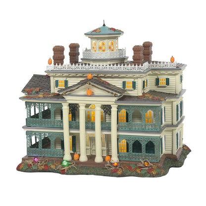 Haunted Mansion ceramic jack lantern ornament with lit windows, ornate teal porch railings on Tampa Home & Garden Store
