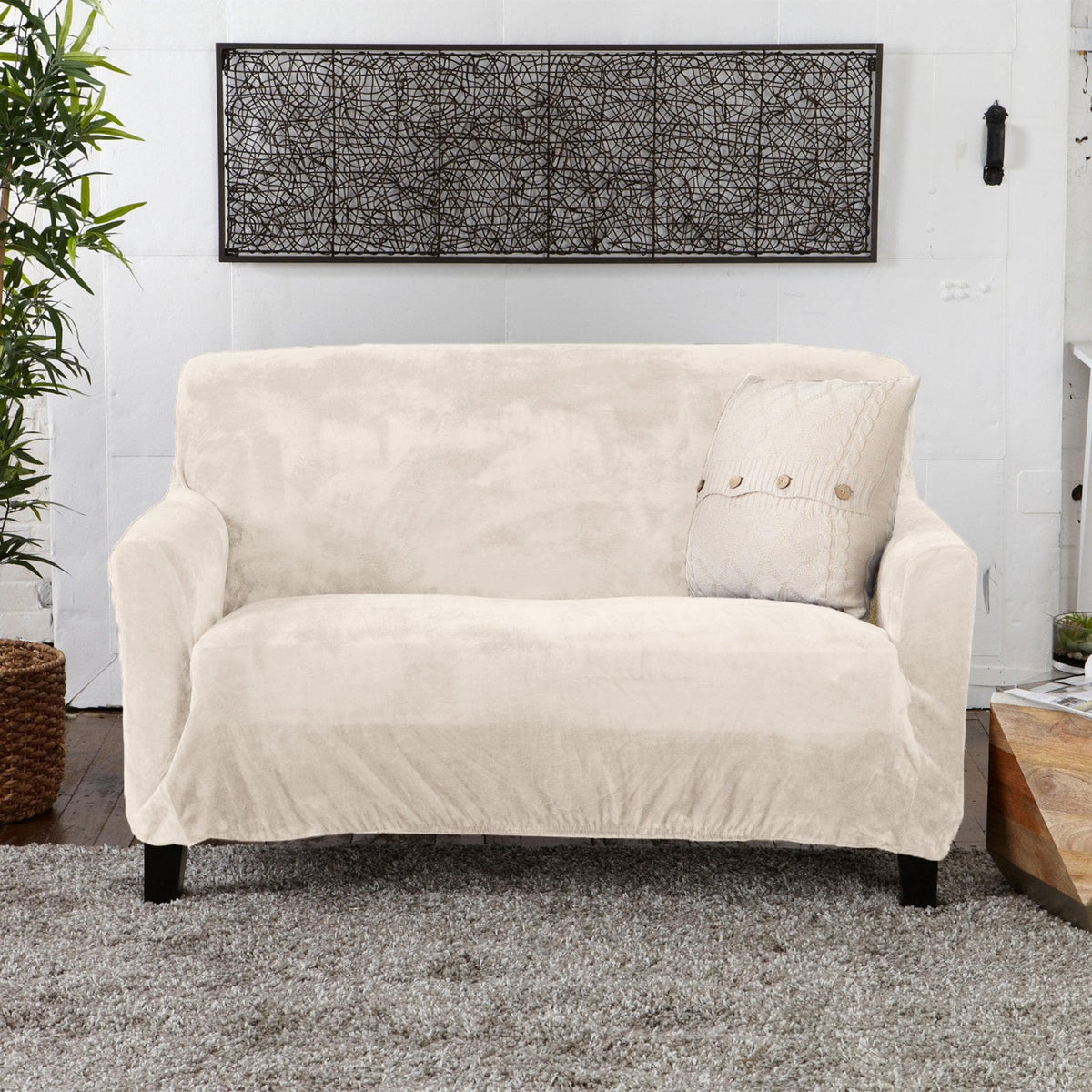 Velvet stretch slipcover Gale Collection on beige sofa on Tampa Home & Garden Store