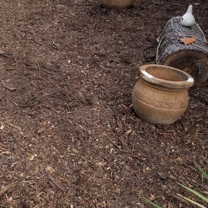 Brown mulch spread over landscape. Buy a truckload of brown mulch delivered including free and fast delivery.