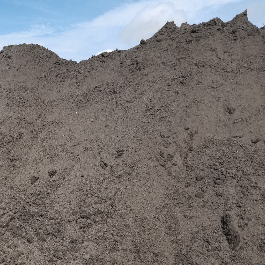 Pile of topsoil for sale near me, topsoil delivery near me Tampa region.