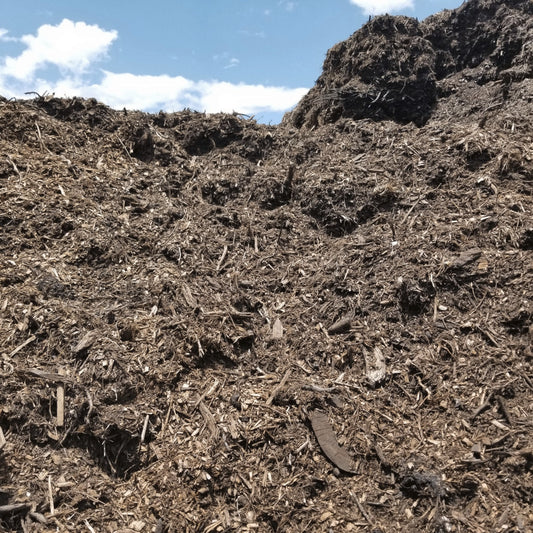 Pile of bulk brown mulch for delivery near me.